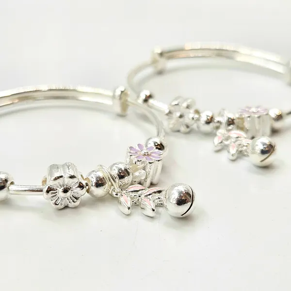 Silver_Baby_Bangles_With_Floral_Charms_And_Jingle_Bell