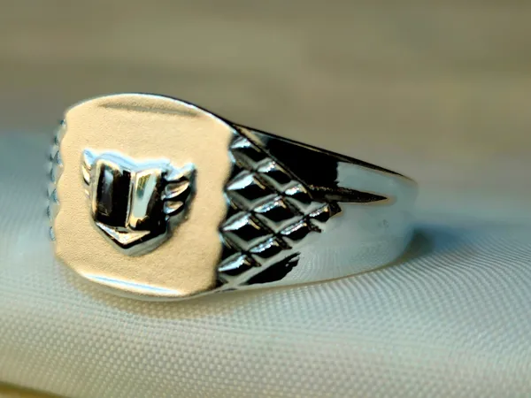 Silver_Winged_Shield_Signet_Ring_With_Diamond-Pattern_Shoulders