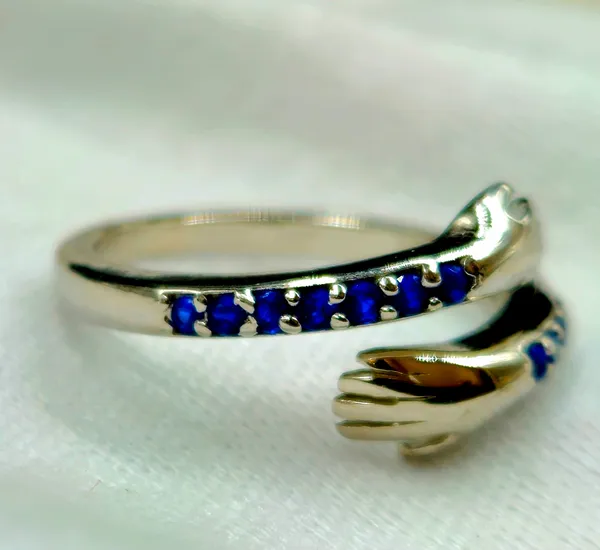 Blue_Gemstone_Hugging_Hands_Ring