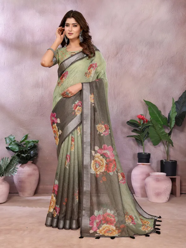 Olive_Green_Olive_Green_And_Black_Saree_Combines_Earthy_Elegance_With_Bold_Floral_Charm._Featuring_Large,_Vibrant_Floral_Prints_In_Shades_Of_Yellow,_Pink,