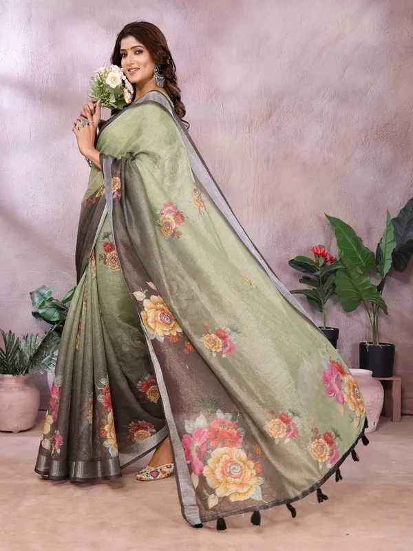 Olive_Green_Olive_Green_And_Black_Saree_Combines_Earthy_Elegance_With_Bold_Floral_Charm._Featuring_Large,_Vibrant_Floral_Prints_In_Shades_Of_Yellow,_Pink,
