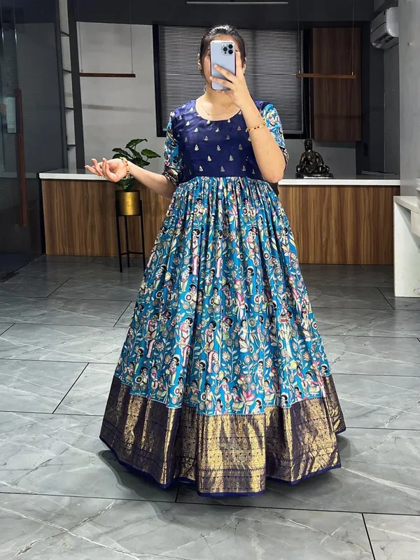 Blue_Premium_Kalamkari_Soft_Dola_Silk_Gown_with_Foil_Work_Border_–_Adjustable_Free_Size_Gown_Collections