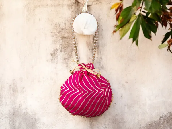 Bandhani_Style_Round_Potli_Bag_With_Golden_Handle_-_Pink