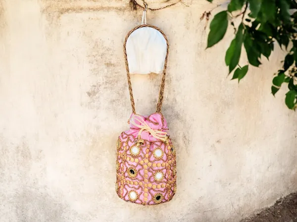 Royal_Embroidered_Potli_Bag_With_Mirror_Work_And_Braided_Handle