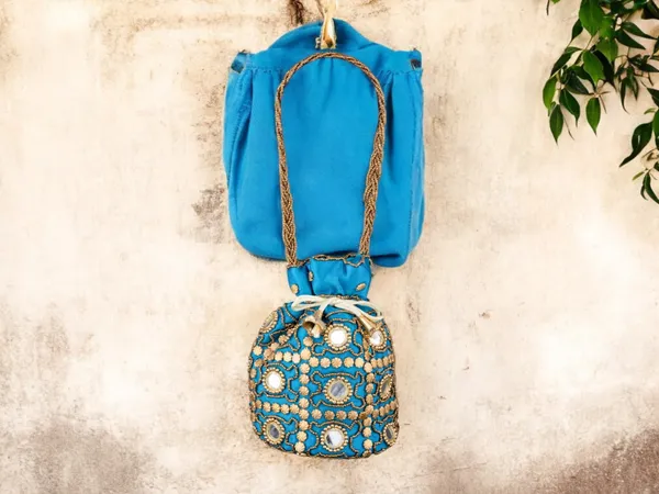 Royal_Embroidered_Potli_Bag_With_Mirror_Work_And_Braided_Handle
