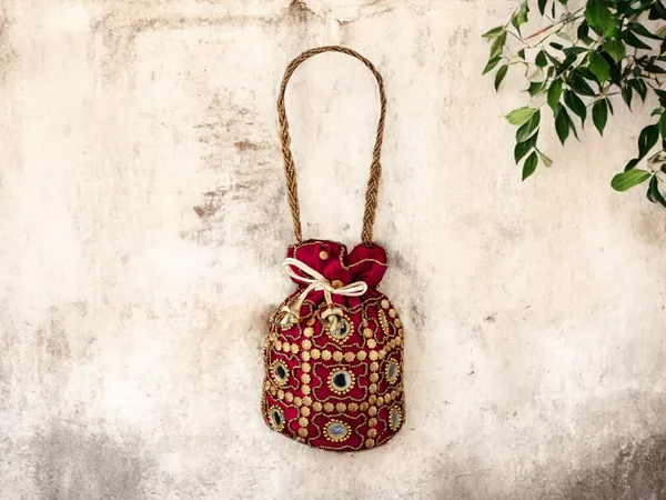 Royal_Embroidered_Potli_Bag_With_Mirror_Work_And_Braided_Handle