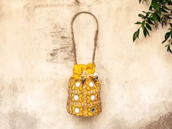 Royal_Embroidered_Potli_Bag_With_Mirror_Work_And_Braided_Handle