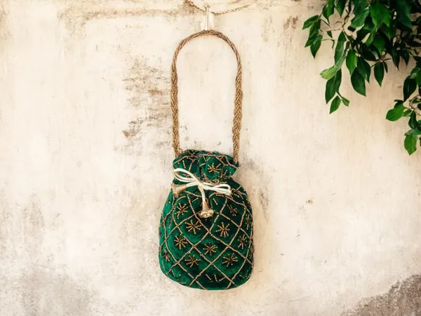 Fuchsia_Embroidered_Potli_Bag_With_Golden_Beadwork_&_Braided_Handle