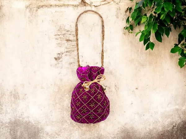 Fuchsia_Embroidered_Potli_Bag_With_Golden_Beadwork_&_Braided_Handle