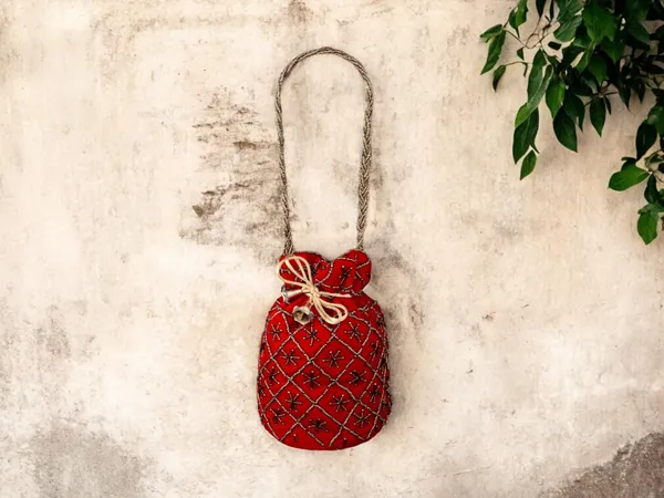 Fuchsia_Embroidered_Potli_Bag_With_Golden_Beadwork_&_Braided_Handle