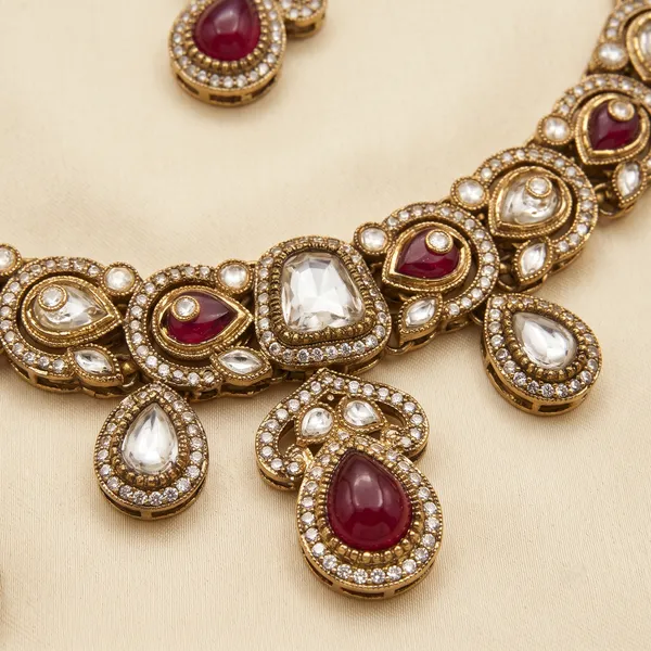 Antique_Gold-Plated_Kundan_Necklace_Set_with_Ruby_Pink_Stones_&_Maang_Tikka