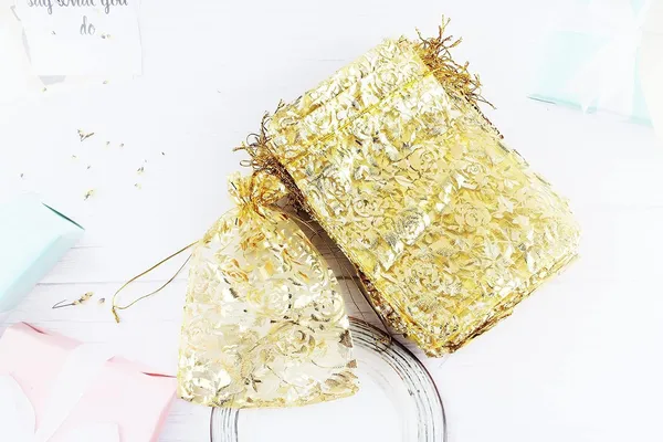 DNY_�??_50_Pcs_Potli_Bags,_Organza_Pouches_7X9_Inches_with_Drawstring_Small_Potli_Bags_for_Return_Gifts_for_Wedding|_Party_|Baby_Shower|_Dry_Fruit_Pouches_(Gold_Flower)