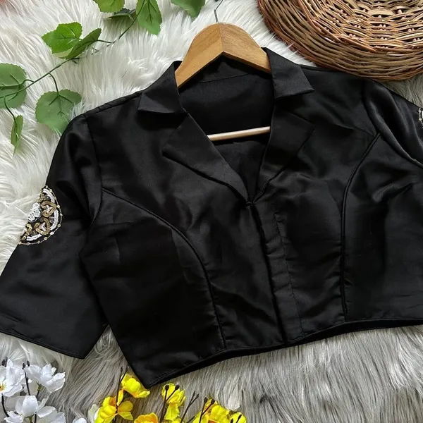 Crafted_in_rich_satin-finish_fabric,_this_blouse_features_a_stunning_hand_embroidered_sleeve_motif