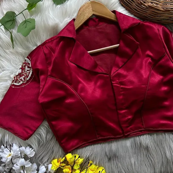 Crafted_in_rich_satin-finish_fabric,_this_blouse_features_a_stunning_hand_embroidered_sleeve_motif