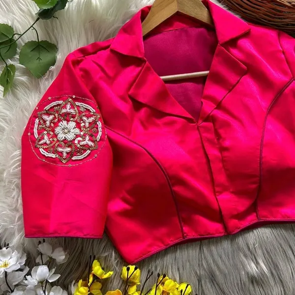 Crafted_in_rich_satin-finish_fabric,_this_blouse_features_a_stunning_hand_embroidered_sleeve_motif