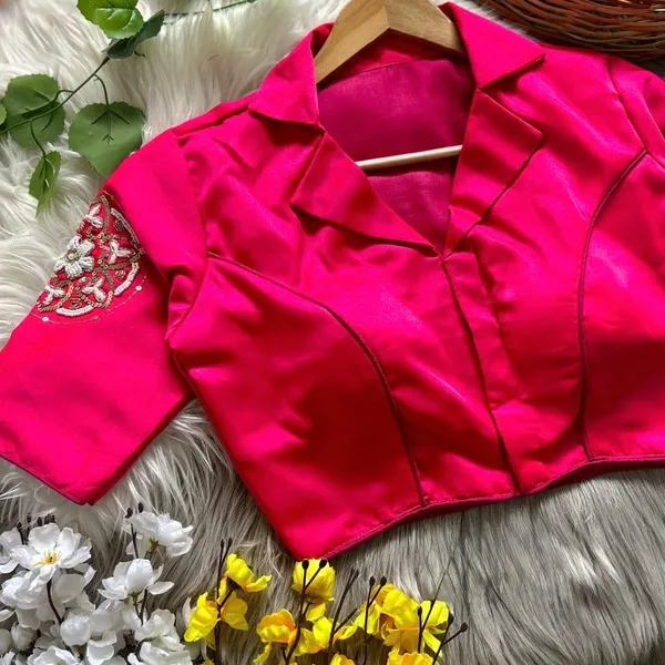 Crafted_in_rich_satin-finish_fabric,_this_blouse_features_a_stunning_hand_embroidered_sleeve_motif
