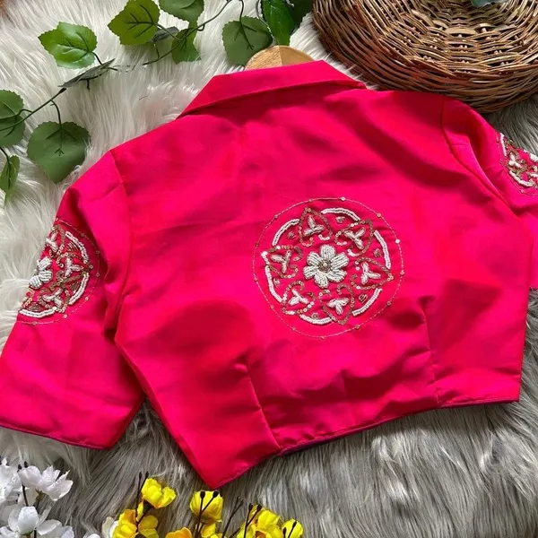 Crafted_in_rich_satin-finish_fabric,_this_blouse_features_a_stunning_hand_embroidered_sleeve_motif
