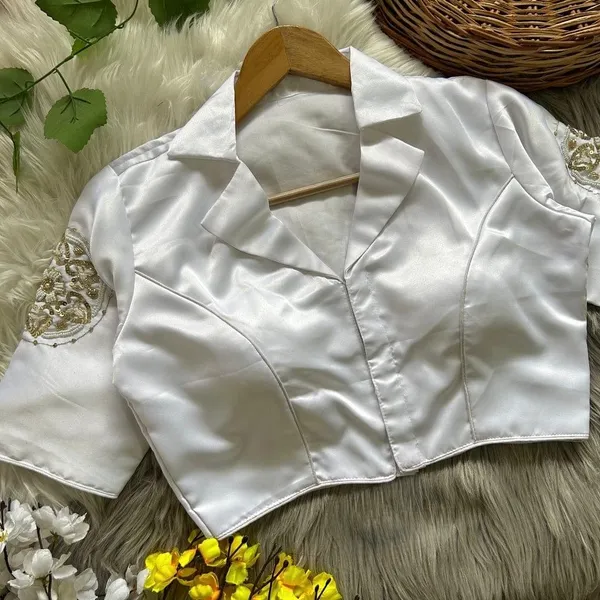 Crafted_in_rich_satin-finish_fabric,_this_blouse_features_a_stunning_hand_embroidered_sleeve_motif
