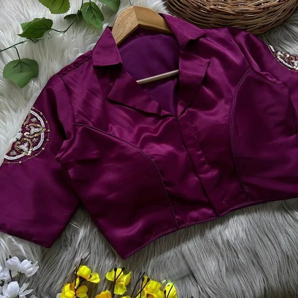 Crafted_in_rich_satin-finish_fabric,_this_blouse_features_a_stunning_hand_embroidered_sleeve_motif