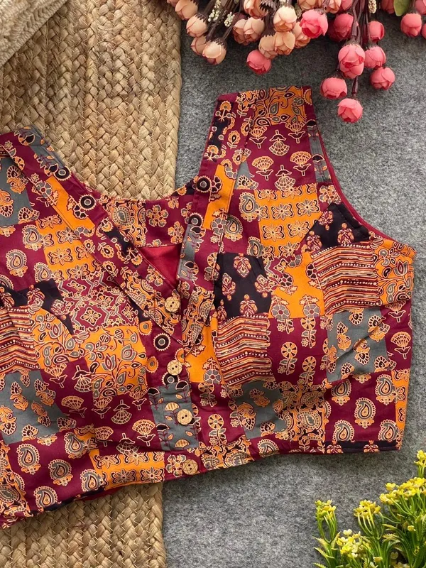 This_is_a_pure_Ajrakh_cotton,_handloom,_boat_neck_blouse_with_a_front_hook_closure_and_a_multicolor_patchwork_print.