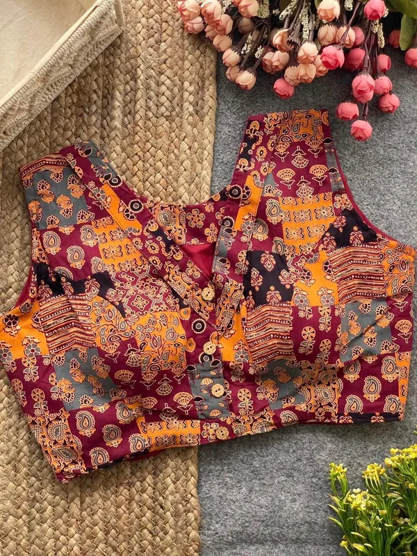 This_is_a_pure_Ajrakh_cotton,_handloom,_boat_neck_blouse_with_a_front_hook_closure_and_a_multicolor_patchwork_print.
