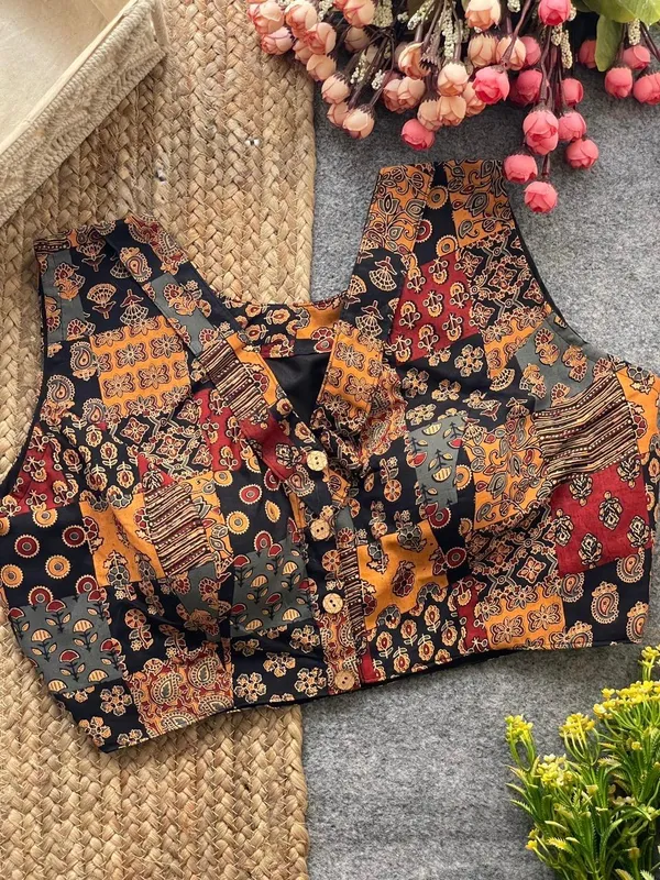 This_is_a_pure_Ajrakh_cotton,_handloom,_boat_neck_blouse_with_a_front_hook_closure_and_a_multicolor_patchwork_print.