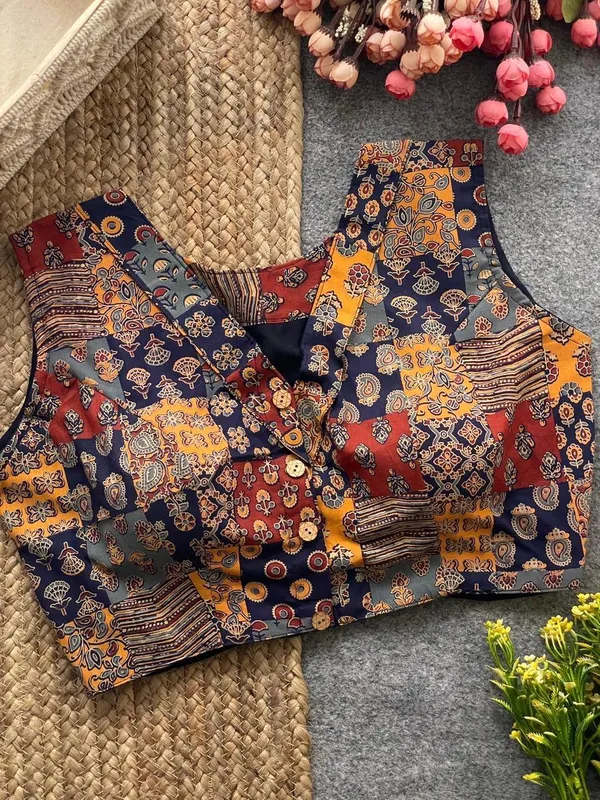 This_is_a_pure_Ajrakh_cotton,_handloom,_boat_neck_blouse_with_a_front_hook_closure_and_a_multicolor_patchwork_print.