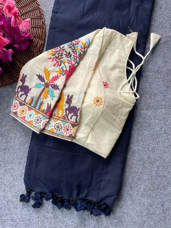 This_is_a_pure_khadi_cotton_blouse_with_multi-thread_embroidery,_paired_with_saree.
