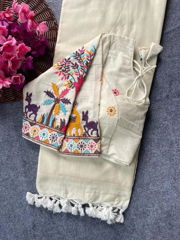 This_is_a_pure_khadi_cotton_blouse_with_multi-thread_embroidery,_paired_with_saree.