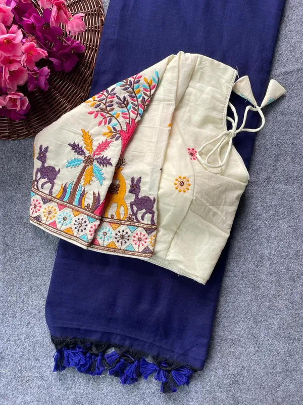 This_is_a_pure_khadi_cotton_blouse_with_multi-thread_embroidery,_paired_with_saree.