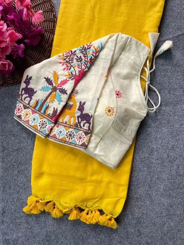 This_is_a_pure_khadi_cotton_blouse_with_multi-thread_embroidery,_paired_with_saree.