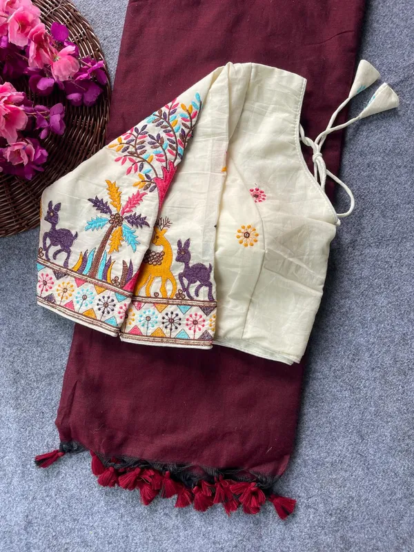 This_is_a_pure_khadi_cotton_blouse_with_multi-thread_embroidery,_paired_with_saree.