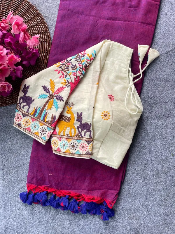 This_is_a_pure_khadi_cotton_blouse_with_multi-thread_embroidery,_paired_with_saree.