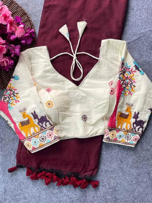 This_is_a_pure_khadi_cotton_blouse_with_multi-thread_embroidery,_paired_with_saree.