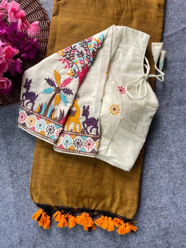 This_is_a_pure_khadi_cotton_blouse_with_multi-thread_embroidery,_paired_with_saree.