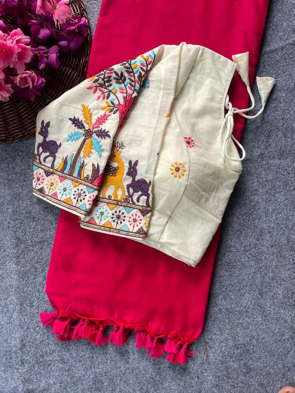 This_is_a_pure_khadi_cotton_blouse_with_multi-thread_embroidery,_paired_with_saree.