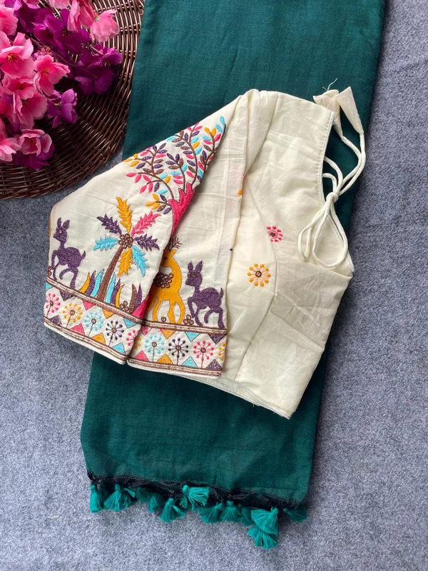 This_is_a_pure_khadi_cotton_blouse_with_multi-thread_embroidery,_paired_with_saree.