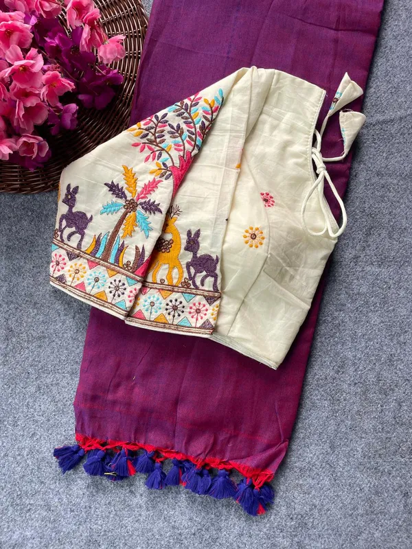 This_is_a_pure_khadi_cotton_blouse_with_multi-thread_embroidery,_paired_with_saree.