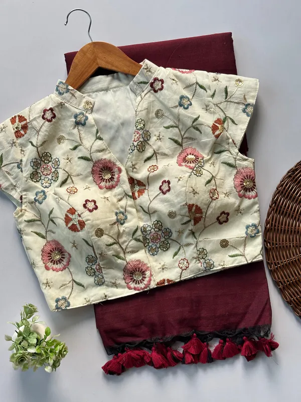 a_flattering_V-neck_blouse_is_designed_to_elevate_your_festive_saree_styling_with_subtle_elegance