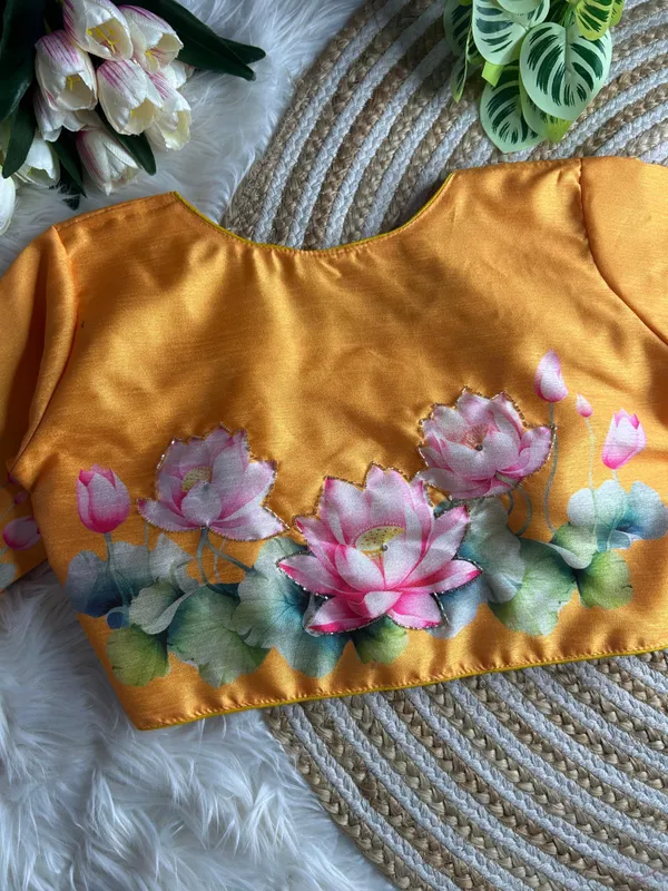 print_and_handwork_of_pink_lotus_flowers_and_green_leaves_across_the_back_and_sleeves