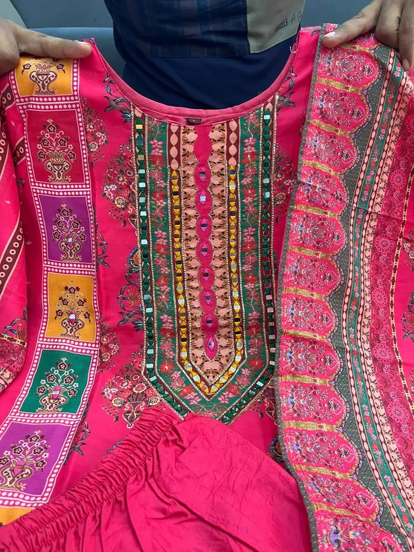 Wrap_yourself_in_elegance_this_festive_with_our_DIYA_PINK__READYMADE_Suit_,_featuring_intricate_Schiffli_MIRROR_AND_HAND_WORKS_and_thread_kodi._Perfect_for_celebrating_the_bond_of_love._A_blend_of_tradition_and_modernity,_just_like_the_bond_you_share