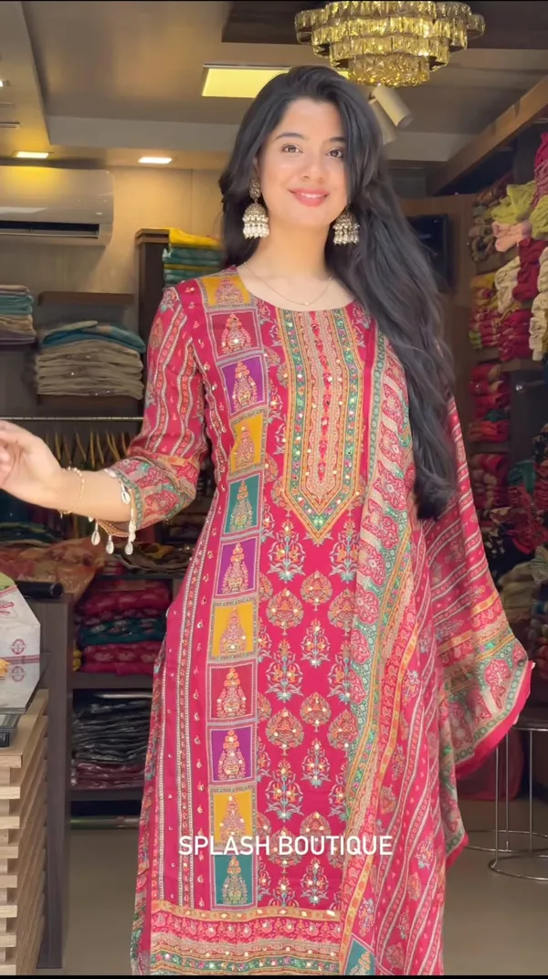 Wrap_yourself_in_elegance_this_festive_with_our_DIYA_PINK__READYMADE_Suit_,_featuring_intricate_Schiffli_MIRROR_AND_HAND_WORKS_and_thread_kodi._Perfect_for_celebrating_the_bond_of_love._A_blend_of_tradition_and_modernity,_just_like_the_bond_you_share