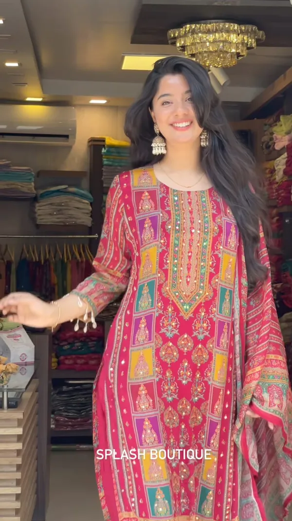 Wrap_yourself_in_elegance_this_festive_with_our_DIYA_PINK__READYMADE_Suit_,_featuring_intricate_Schiffli_MIRROR_AND_HAND_WORKS_and_thread_kodi._Perfect_for_celebrating_the_bond_of_love._A_blend_of_tradition_and_modernity,_just_like_the_bond_you_share