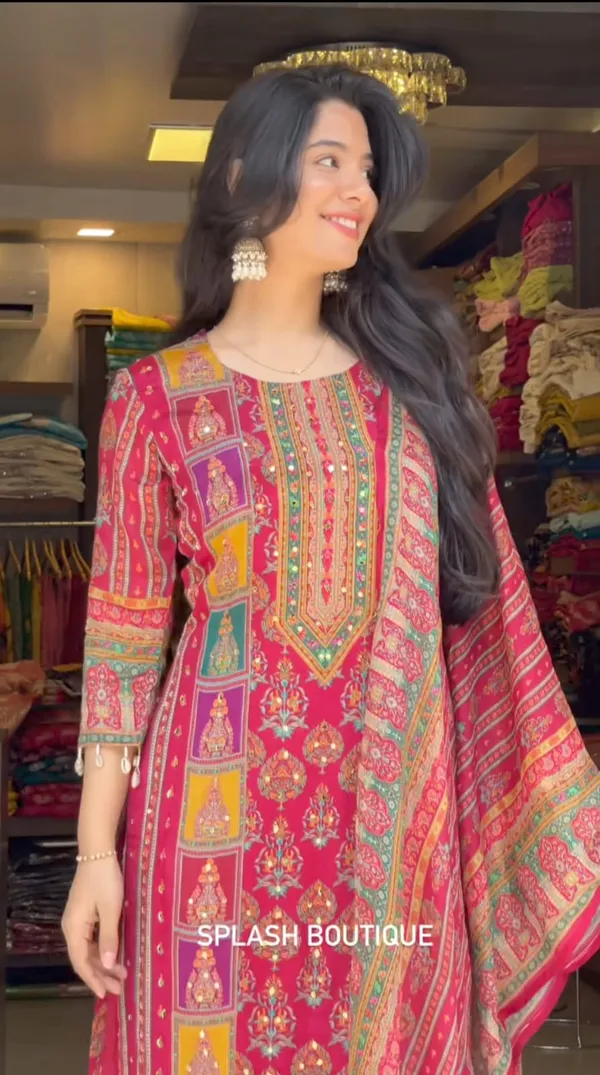 Wrap_yourself_in_elegance_this_festive_with_our_DIYA_PINK__READYMADE_Suit_,_featuring_intricate_Schiffli_MIRROR_AND_HAND_WORKS_and_thread_kodi._Perfect_for_celebrating_the_bond_of_love._A_blend_of_tradition_and_modernity,_just_like_the_bond_you_share