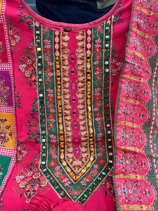 Wrap_yourself_in_elegance_this_festive_with_our_DIYA_PINK__READYMADE_Suit_,_featuring_intricate_Schiffli_MIRROR_AND_HAND_WORKS_and_thread_kodi._Perfect_for_celebrating_the_bond_of_love._A_blend_of_tradition_and_modernity,_just_like_the_bond_you_share