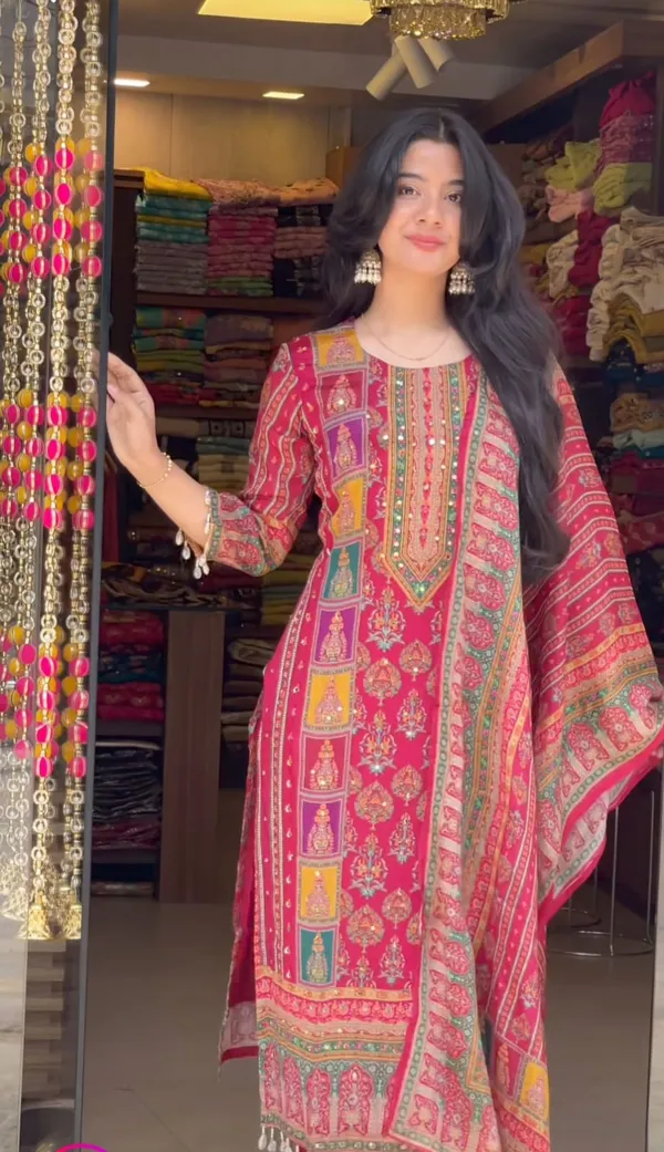 Wrap_yourself_in_elegance_this_festive_with_our_DIYA_PINK__READYMADE_Suit_,_featuring_intricate_Schiffli_MIRROR_AND_HAND_WORKS_and_thread_kodi._Perfect_for_celebrating_the_bond_of_love._A_blend_of_tradition_and_modernity,_just_like_the_bond_you_share