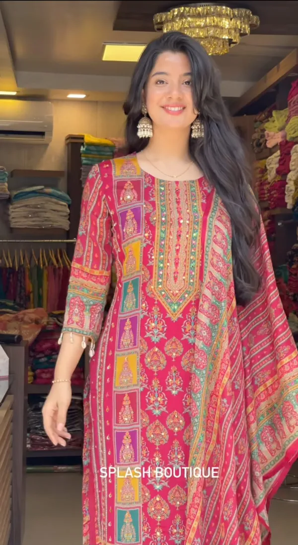 Wrap_yourself_in_elegance_this_festive_with_our_DIYA_PINK__READYMADE_Suit_,_featuring_intricate_Schiffli_MIRROR_AND_HAND_WORKS_and_thread_kodi._Perfect_for_celebrating_the_bond_of_love._A_blend_of_tradition_and_modernity,_just_like_the_bond_you_share