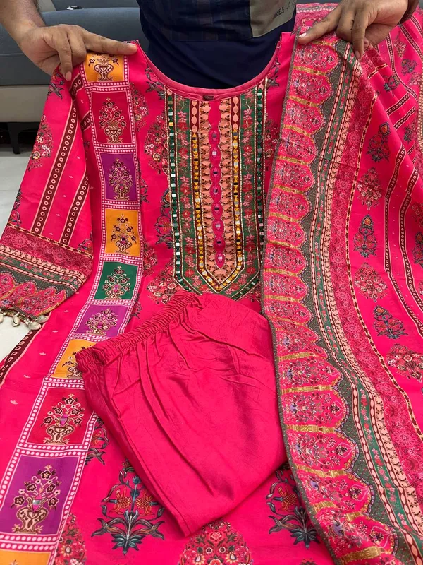 Wrap_yourself_in_elegance_this_festive_with_our_DIYA_PINK__READYMADE_Suit_,_featuring_intricate_Schiffli_MIRROR_AND_HAND_WORKS_and_thread_kodi._Perfect_for_celebrating_the_bond_of_love._A_blend_of_tradition_and_modernity,_just_like_the_bond_you_share