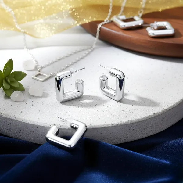 Modern_Geometric_Silver_Hoop_Earrings_?_Sleek_Statement_Style