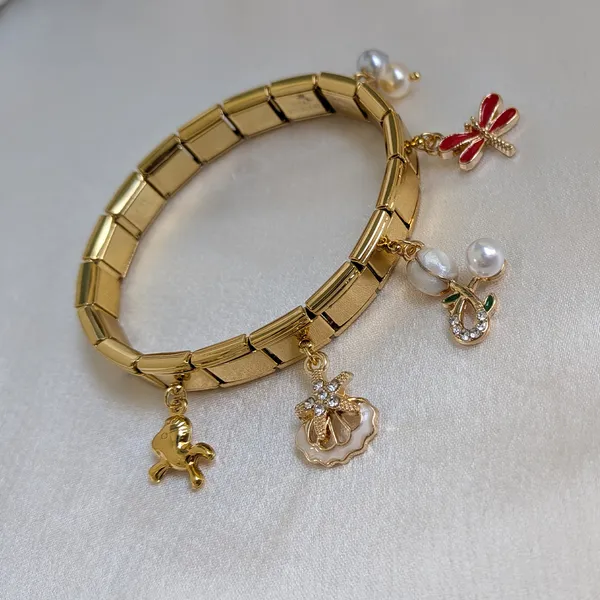Playful_Gold_Plated_Charm_Bracelet_with_Pearl,_Dragonfly_&_Bow_Charms_Accents